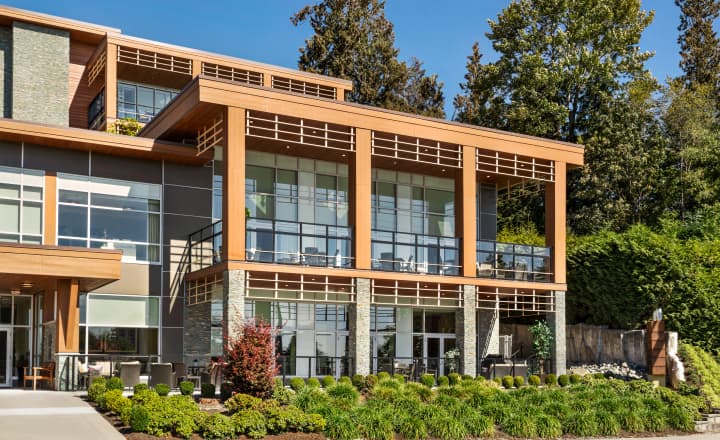 LionsGate-home-exterior_shot_of_building Amica Lions Gate's exterior shot of the building with surrounding greenery.