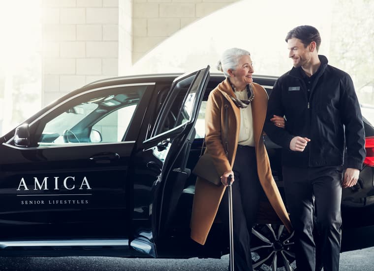 Lifestyle Shoot - Resident and Driver with Town Car Female resident exiting Amica town car with support of male driver